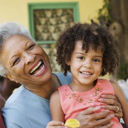 Grandmother and granddaughter together playing in the park