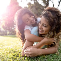 Mother and daughter together playing in the park